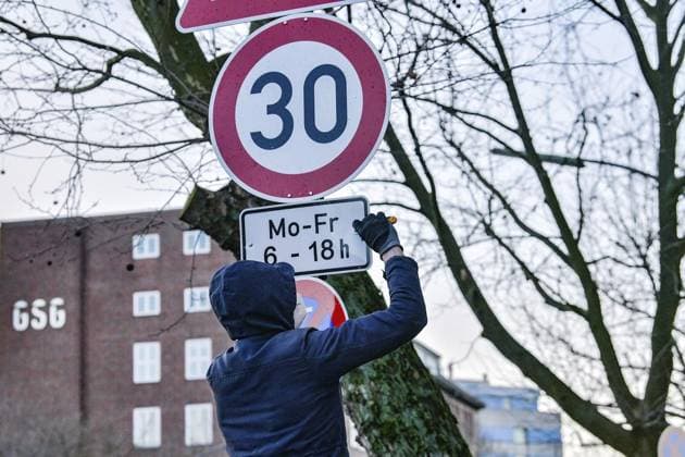 Berlin, Extinction Rebellion activists unscrew traffic sign
