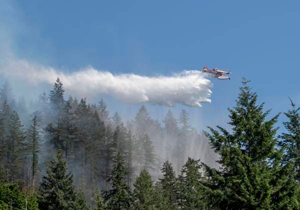 Canada, tanker planes drop water on a brush fire near Whyte Lake in West Vancouver