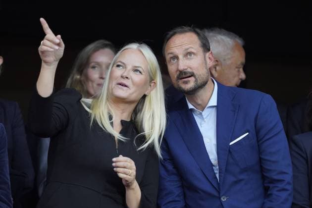Mette Marit and Haakon attend national team football match