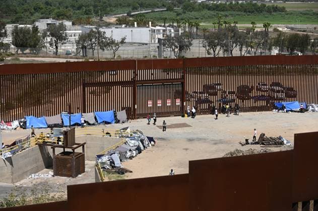 Mexico, people stuck between border fences with the USA near Tijuana