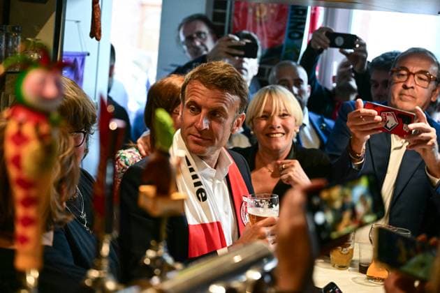 France, Emmanuel Macron with football fans in a pub in Tourcoing