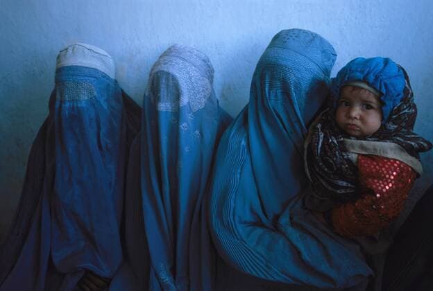 Afghanistan takeover by Taliban, women wearing burqa in public - stock footage