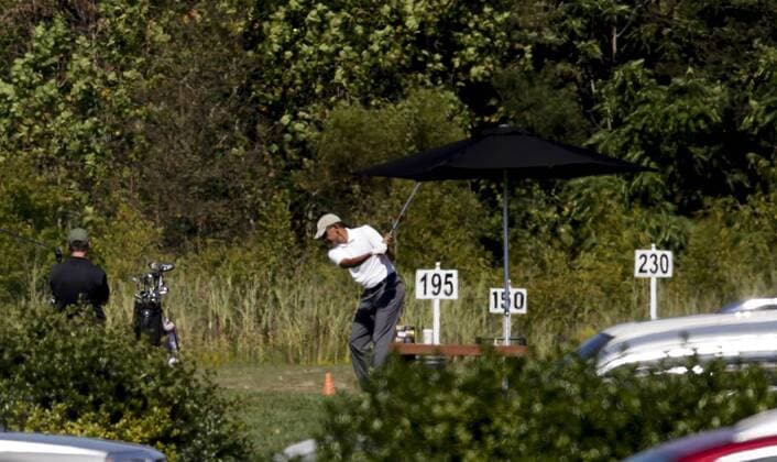 US President Obama plays golf
