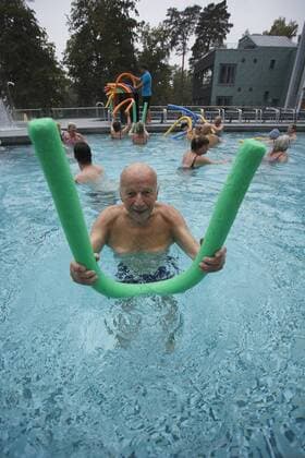 Senior doing aqua gymnastics: Model release