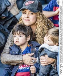 Shakira cheers with her sons in the football stands