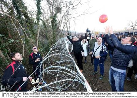 Volleyball match at the barbed wire border fence between Croatia and Slovenia