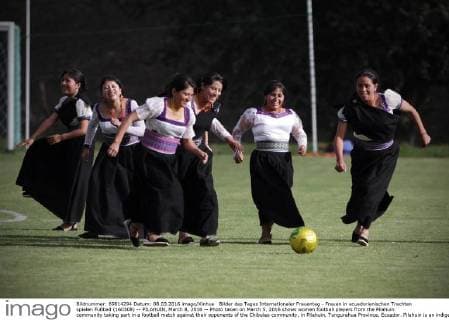 International Women's Day - Women in Ecuadorian costumes play football