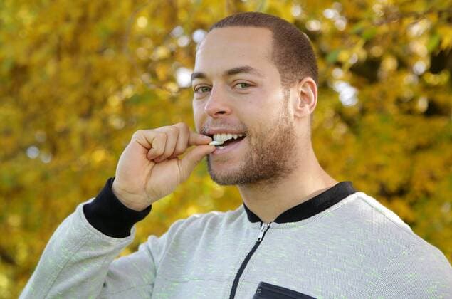 Basketball player Andrej Mangold presents his product Chewing gum