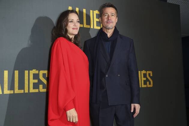 Marion Cotillard and Brad Pitt at the premiere of Allied - Familiar Strangers in Paris