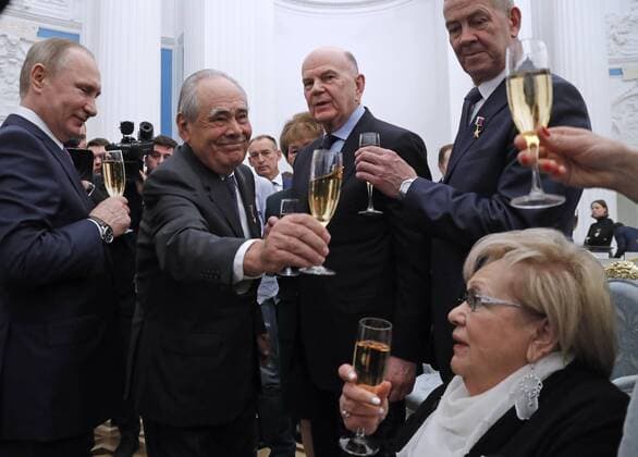 Putin after award ceremony at champagne reception in Moscow