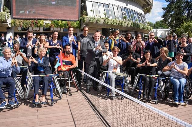 Anne Hidalgo plays on the sidelines of the French Open wheelchair tennis