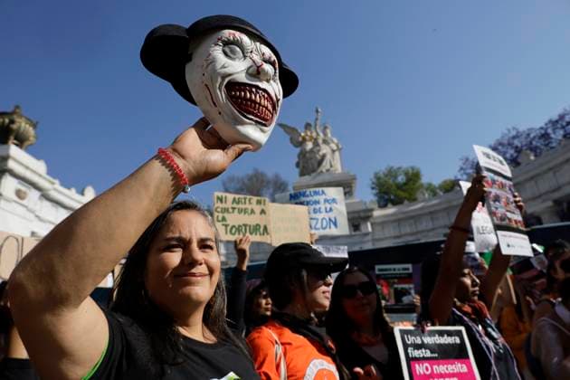 Mexico City, animal rights activists celebrate the adoption of a resolution to ban bullfighting