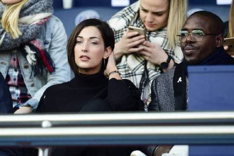 Celebrities on the sidelines of a football match in Paris Saint Germain
