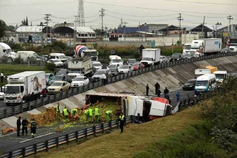 Mexico: truck loaded with cabbage tips over