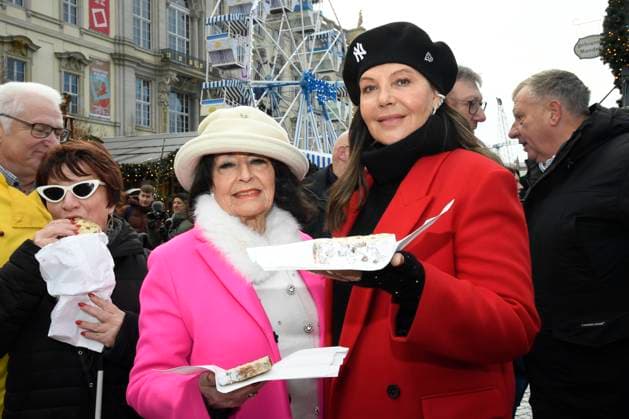 Berlins longest Christmas cake: Natascha Ochsenknecht cuts 30-metre-long biscuits at winter market