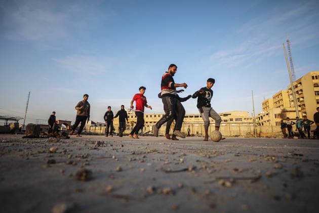 Middle East conflict, Gaza, Young people play football in Gaza City
