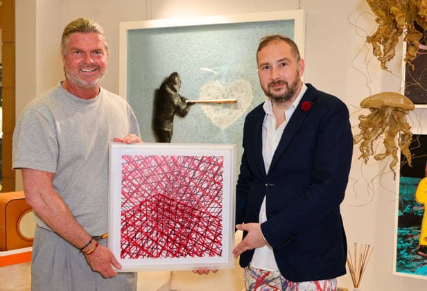 Artist Adrian Bedoy with one of his works Puerto Portals Pink Panthers Collectors Club Mallorca