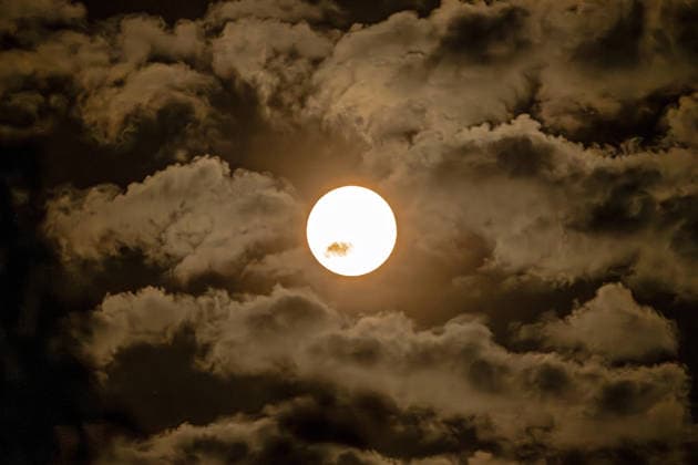 Bavaria, full moon in the night sky over Munich