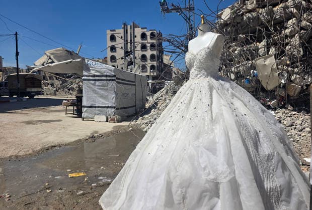 Middle East conflict, Gaza, customers buy wedding clothes in Khan Yunis
