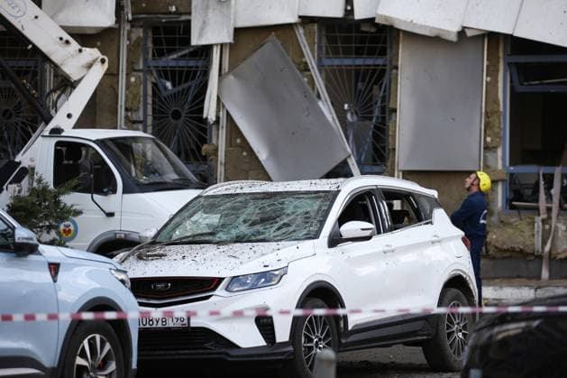 Russia, car in front of apartment block after reported Ukrainian drone attack