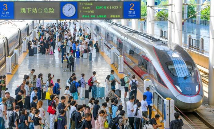 China: Passengers board a Fuxing high-speed train