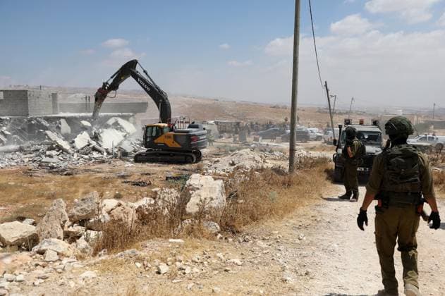 West Bank: Israeli forces oversee the demolition of two Palestinian homes near Hebron