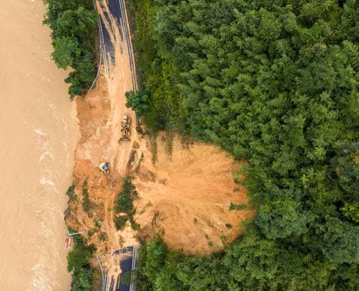 China: Emergency repairs to a damaged road following flooding in Guangxi