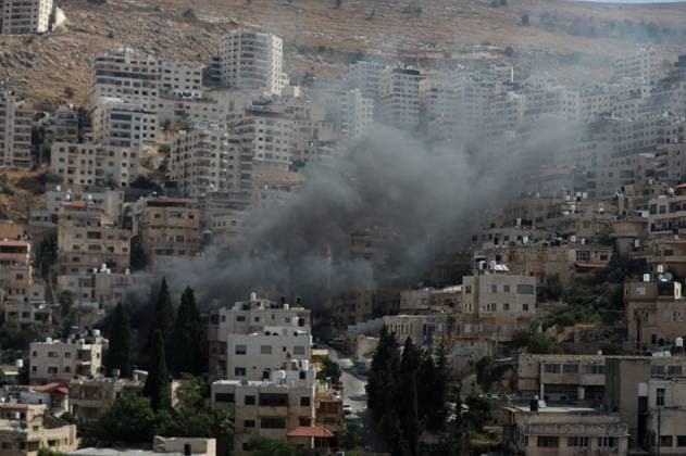 West Bank, Nablus: Smoke following the demolition of a house by Israeli forces