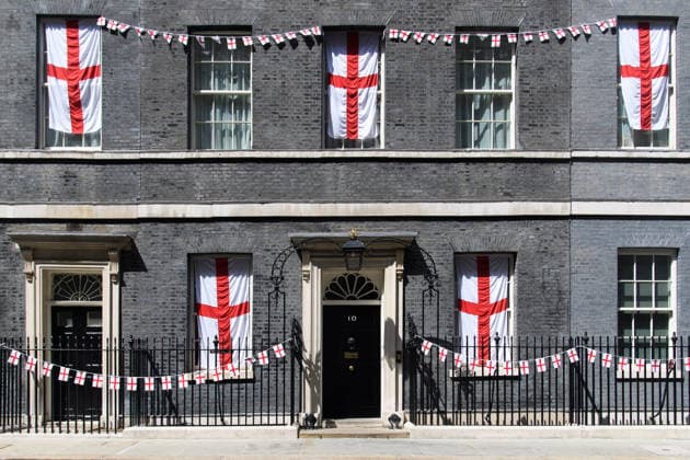 United Kingdom, England – flags and pennants in the windows of Downing Street ahead of the World Cup semi-final against Argentina in London