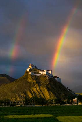China, a rainbow over Sangzhu Zizong Castle