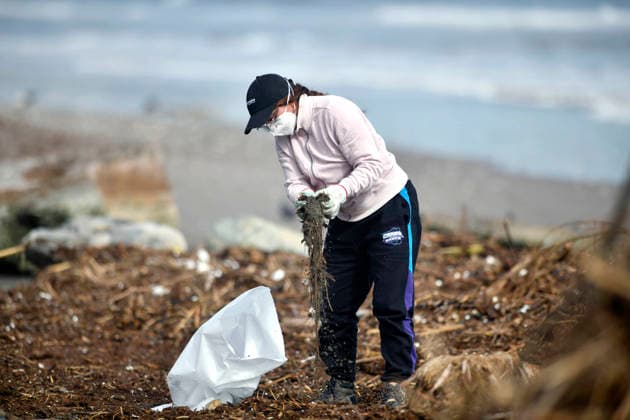 Chile: Volunteers and the local council clean up the coast following a storm in La Serena