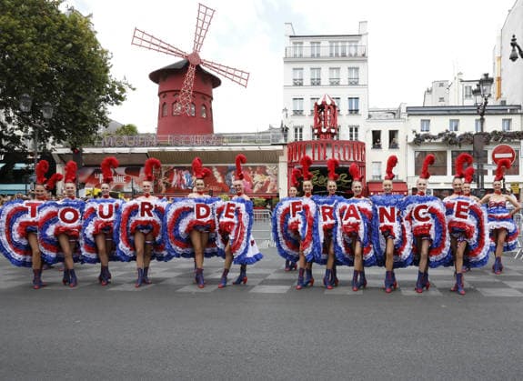 France: Dancers perform outside the Moulin Rouge in Paris as part of the Tour de France