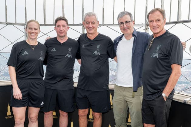 Celebrity, John Oliver and representatives of Liverpool FC visit the Empire State Building in New York