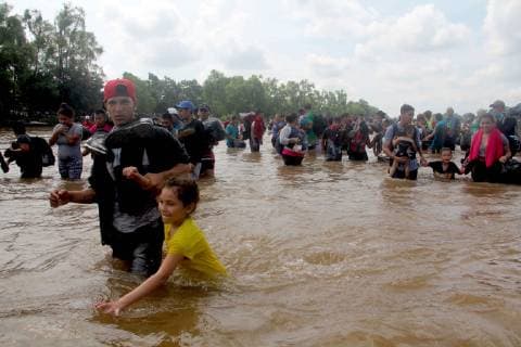 Mexico, migrants at the border river to Guatemala