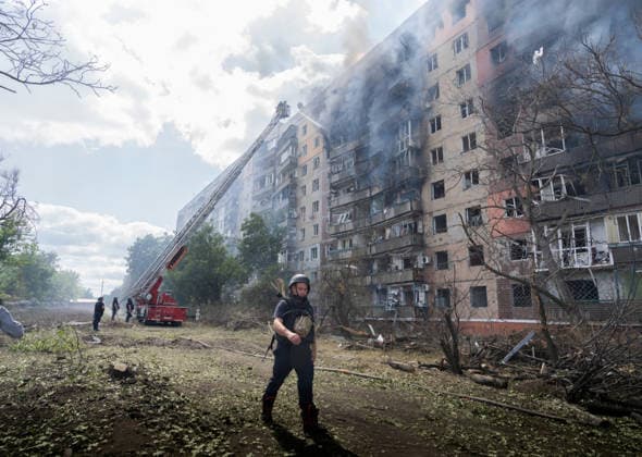 War in Ukraine: Firefighters tackle blazes following Russian air strikes on a residential area in Kramatorsk