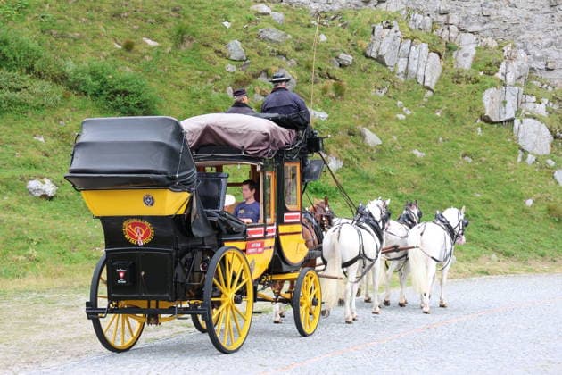 Switzerland, historic stagecoach crossing the Gotthard Pass