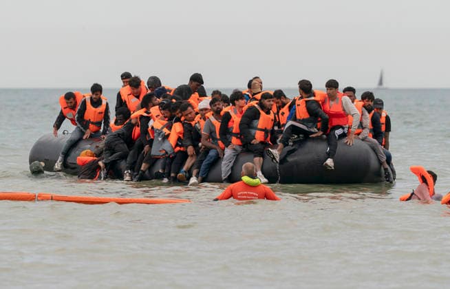 English Channel, boat carrying refugees near Ecault, France