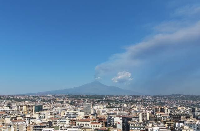 Italy, smoke rising from Mount Etna near Catania