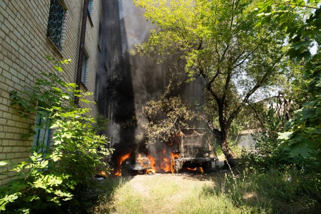 War in Ukraine: Fire brigade extinguishes burning vehicles following a Russian drone attack in Kramatorsk