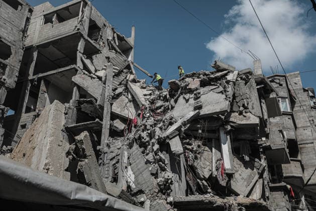 Middle East conflict, Gaza, demolition work on damaged buildings in al-Bureij