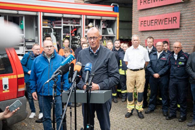 North Rhine-Westphalia, Friedrich Merz and District Administrator Ralf Nolten at a press conference in the area affected by the forest fire in Hürtgen