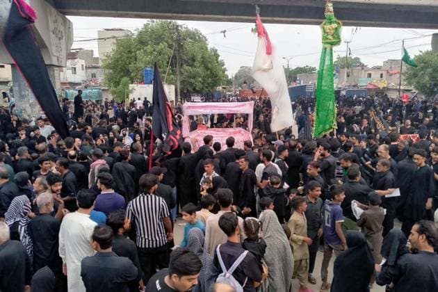 Pakistan: Shia worshippers take part in the Chup-Tazia procession in Hyderabad