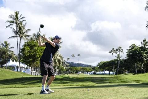 Honolulu, actor Tom Holland plays golf