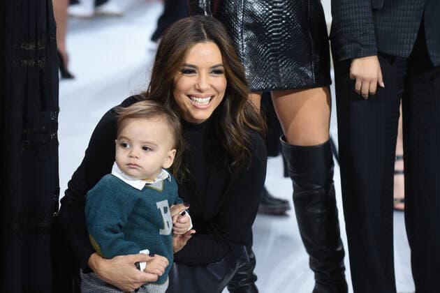 Eva Longorias son Santiago is the showcase for the models at the Paris Fashion Week.