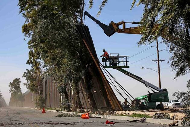 Border between USA and Mexico, wind blows border fence