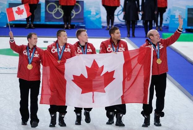 Feb. 27, 2010 - Vancouver, BC, Canada - VANCOUVER, BC: FEBRUARY 27, 2010 -- Canada s men s curling team (left to right) Adam Enright (alternate), Ben Hebert (lead), Marc Kennedy (second), John Morris (third) and Kevin Martin (skip) celebrate and wave to fans after winning the men s Olympic curling goldmedal game against Norway at the Vancouver Olympic Centre on Day 16 of the 2010 Winter Olympic Games in Vancouver, BC February 27, 2010. Canada beat Norway 6 - 3 in ten ends. - ZUMAw51 o0 Freude Jubel Sieg Olympiasieg Medaille Goldmedaille Gold Fahne, Nationalfahne