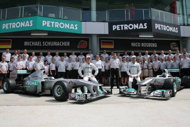 10.04.2011- Michael Schumacher (GER, L), Mercedes GP Petronas F1 Team, MGP W02 and Nico Rosberg (GER, R), Mercedes GP Petronas F1 Team, and Ross Brawn (GBR), Team Principal, MGP W02, Team photo Malaysian Grand Prix, Sepang, Round 2, 07-10 Aprile 2011