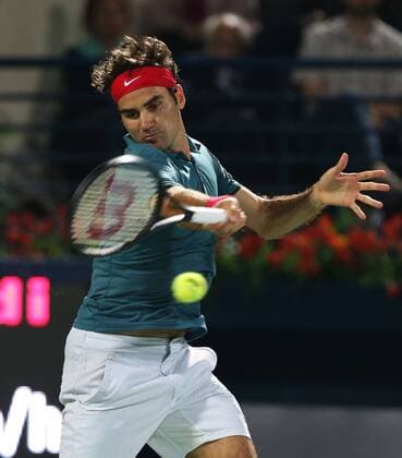 Dubai Tennis Championships 2014, ATP Tennis Herren Tennis Turnier,International Series,Dubai Tennis Stadium, U.A.E.,Final,Endspiel,Roger Federer (SUI),Aktion, Einzelbild,Halbkörper,Hochformat,