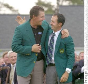 April 11, 2004 - U.S. - KRT SPORTS STORY SLUGGED: GLF-MASTERS KRT PHOTOGRAPH BY ERIK CAMPOS THE STAMP (April 11) AUGUSTA, GA -- Phil Mickelson, left, gives a hug to last year s winner, Mike Weir. during the Green Jacket presentation following his win at the U.S. Masters golf tournament at the Augusta National Golf Club in Augusta, Georgia, Sunday, April 11, 2004. This was Mickelson s first major tournament win. (nk) 2004 News Archive - April 11, 2004 - ZUMAm67
