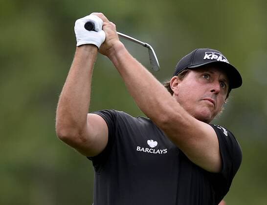 May 13, 2015 - Charlotte, NC, USA - Golf - - Phil Mickelson watches his shot from the second tee box on Wednesday, May 13, 2015, at Quail Hollow Club in Charlotte, N.C. Mickelson missed the first Wells Fargo Championship in 2003, but he s been a regular ever since. While he hasn t won the tournament and often has been critical of the course, he s probably been more loyal and had more influence on it than any other player, including winners Tiger Woods and Rory McIlroy. Wells Fargo Pro-Am round - ZUMAm67_